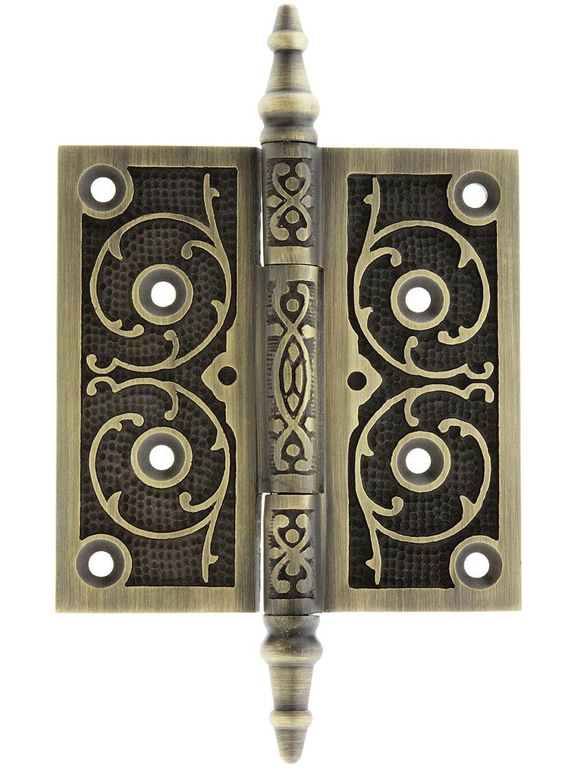 4 inch Solid Brass Steeple Tip Hinge With Decorative Vine Pattern in Antique Brass.